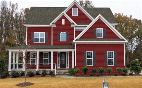 red vinyl siding house with black metal roof|red vinyl home designs.